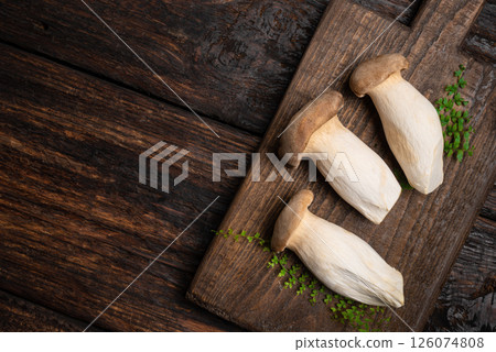 King Oyster Mushroom, Eryngii mushrooms on wooden board 126074808