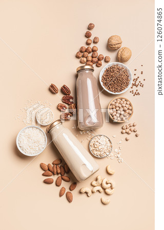 Vegan plant based milk bottles and ingredients. Non dairy drink. 126074865
