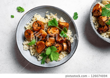 Stir fried teriyaki eryngii mushrooms with rice 126074894