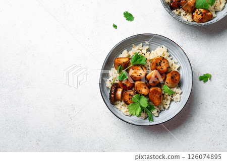 Stir fried teriyaki king oyster mushrooms with rice Stir fried teriyaki king oyster mushrooms with rice 126074895