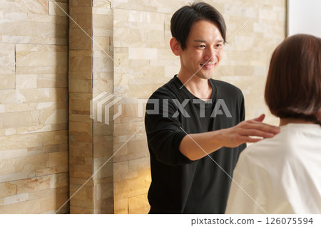 Relaxation staff and senior female customer 126075594