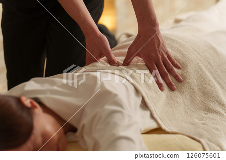 Relaxation staff and senior female customer 126075601