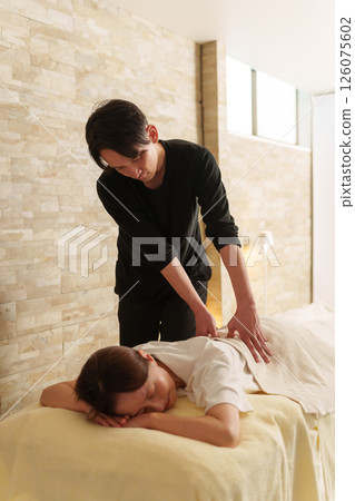Relaxation staff and senior female customer 126075602