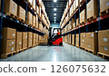 worker operating forklift in a busy warehouse, maneuvering between aisles filled with large boxes, concept of logistics, supply chain management, warehouse operations 126075632