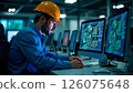engineer wearing a helmet and uniform monitoring automated system controls on computer in manufacturing plant 126075648