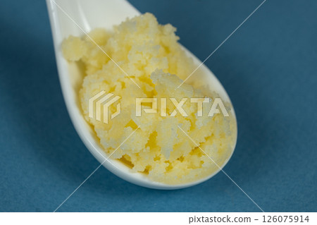 Traditional Indian Ghee In Spoon, Golden Texture. Traditional Indian Ghee In Spoon, Golden Texture. 126075914