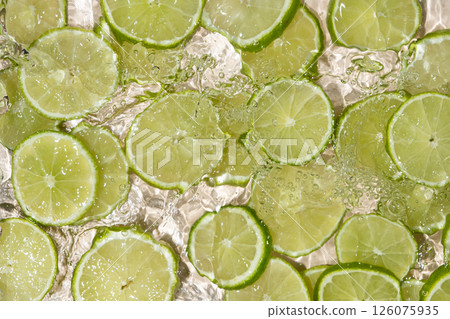 Fresh Limes In Motion. Splashing Water Top View 126075935