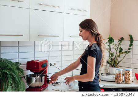 housewife preparing food in the kitchen sweet dessert 126076342