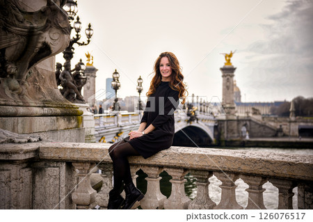 Tourist woman on Alexander III Bridge.05.04.2025 Paris France 126076517