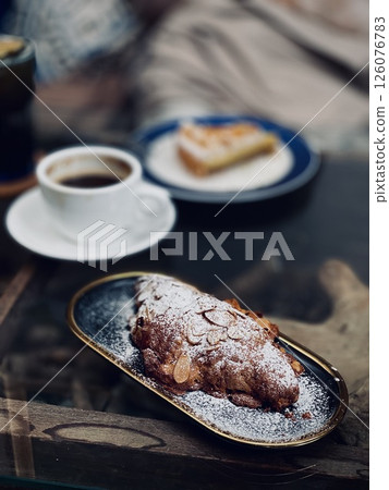 Almond Croissant and Coffee Indulgence Almond Croissant and Coffee Indulgence 126076783