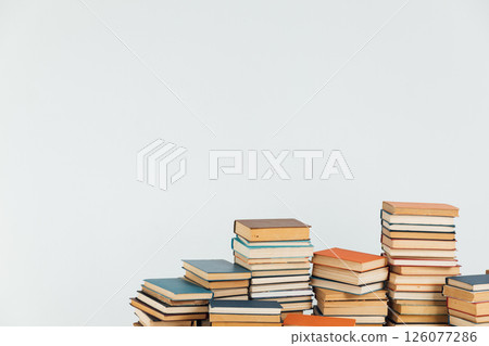 Stacks of educational books for learning on a white background Stacks of educational books for learning on a white background 126077286