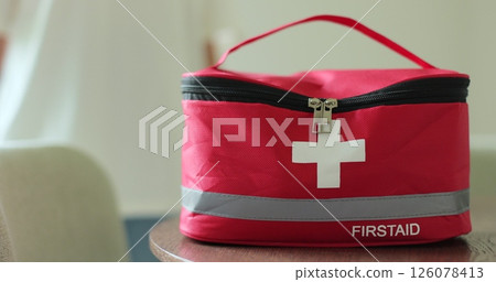 Woman holding first aid kit. Life saving, medical care, accident helping, emergency health care. 126078413