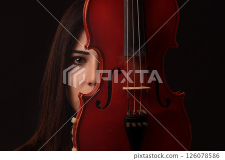Front view portrait of female musician or violinist. Front view portrait of female musician or violinist. 126078586