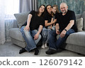 Family on the couch in black t-shirts 126079142