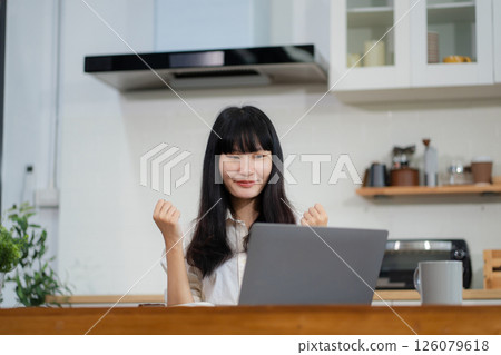 lifestyle of office workers, Woman successful sitting in the kitchen. lifestyle of office workers, Woman successful sitting in the kitchen. 126079618