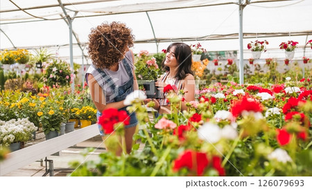 Garden center workers choosing plants in greenhouse 126079693