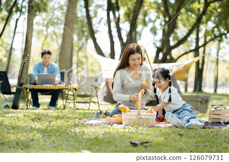 Happy asian family picnic in park, weekend lifestyle outdoors. 126079731