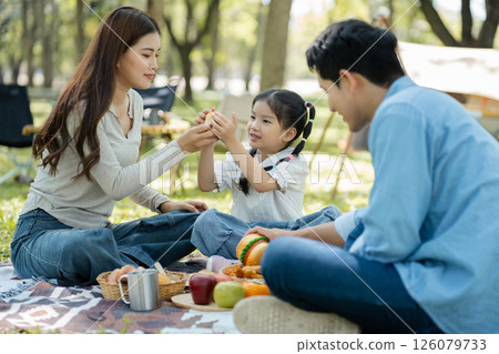 Happy asian family picnic in park, weekend lifestyle outdoors. 126079733