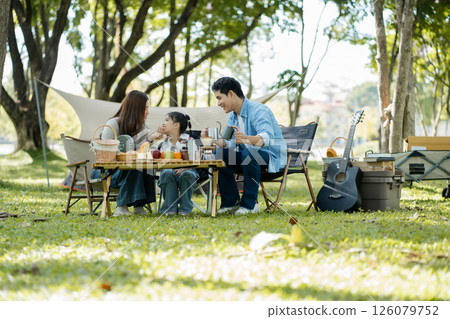 Happy asian family picnic in park, weekend lifestyle outdoors. 126079752