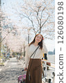 Woman traveling during cherry blossom season 126080198