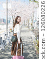 Woman traveling during cherry blossom season 126080226