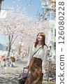 Woman traveling during cherry blossom season 126080228