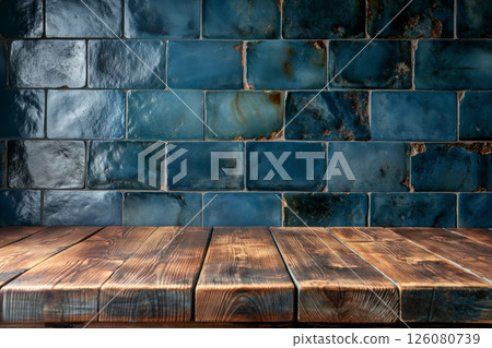 Glossy blue square tiles with a weathered texture, paired with a rustic wooden table below 126080739