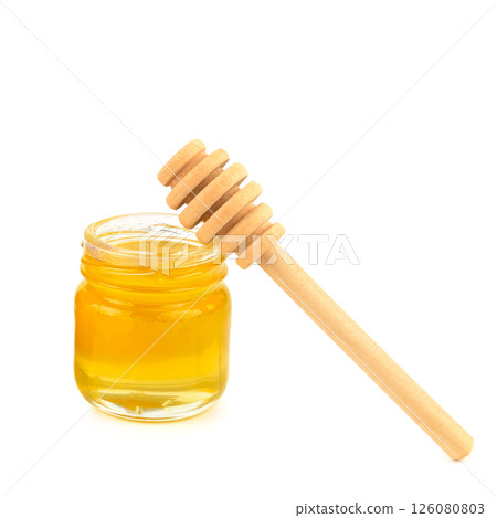 Bee honey in a jar isolated on white background. Bee honey in a jar isolated on white background. 126080803