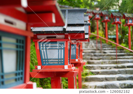 Red lanterns and stone steps line the approach to the shrine Red lanterns and stone steps line the approach to the shrine 126082182