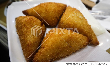 close up of Cantonese snacks deep fried shrimp toast cut into rectangular shape ordered in Cha chaan teng cafe 126082847