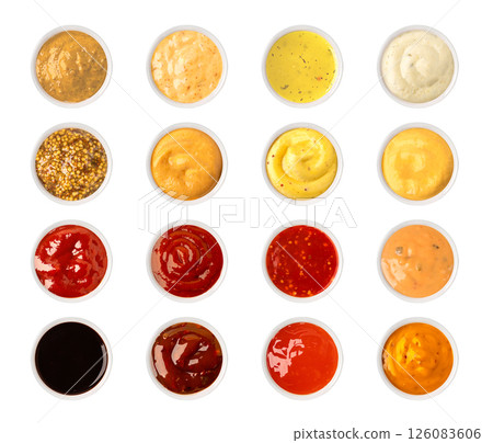 Set of various sauces in bowls, isolated on white background, top view 126083606