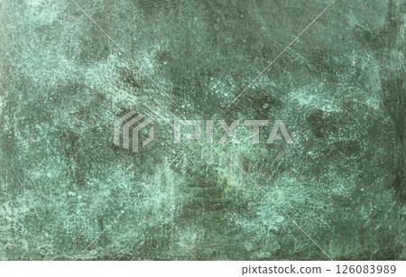 Weathered copper surface showing patina formation and corrosion effects 126083989