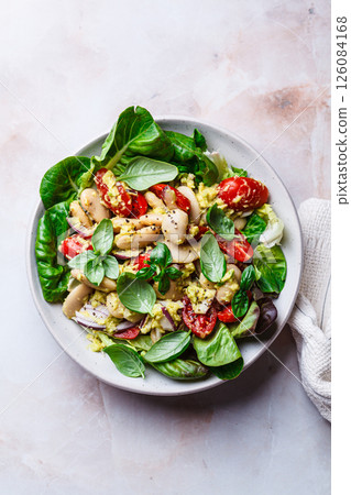Butter bean salad with tomato, basil and avocado dressing. Butter bean salad with tomato, basil and avocado dressing. 126084168