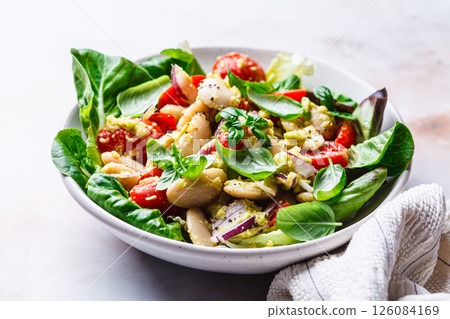 Butter bean salad with tomato, basil and avocado dressing. Butter bean salad with tomato, basil and avocado dressing. 126084169
