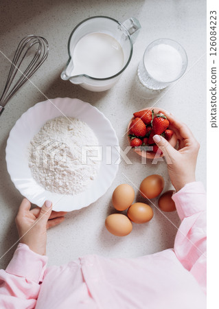 Preparing Ingredients for Baking with Strawberries 126084223