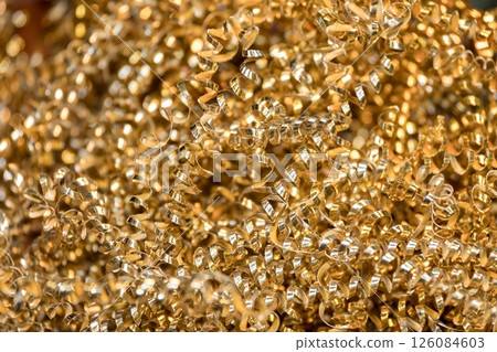 Close up scene scrap brass material pile from turning process. Close up scene scrap brass material pile from turning process. 126084603