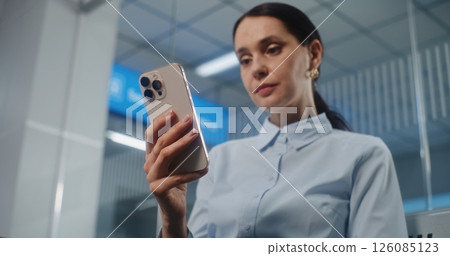 Airport Terminal: Female Entrepreneur Scanning Airplane Ticket Using Smartphone, Checking Information 126085123
