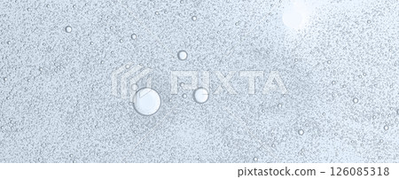 Textured background of cosmetic moisturizing gel or skin serum Textured background of cosmetic moisturizing gel or skin serum 126085318