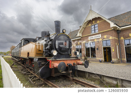 Old steam locomotive waiting at Marrum Westernijkerk station in Friesland, Netherlands 126085930