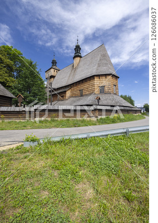 Church of the Assumption of the Blessed Virgin Mary in Haczow, Poland, displaying its unique wooden architecture 126086037