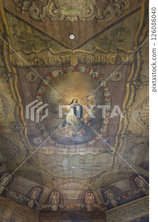 Assumption of mary painting decorating the wooden ceiling of the church of saint michael the archangel in Haczow, Poland 126086040