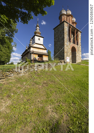 Greek catholic church of the Protection of the Mother of God in Owczary, Poland, facing blue sky 126086067