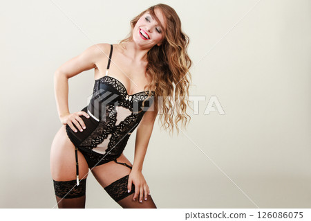 Smiling girl wearing sexy lingerie 126086075