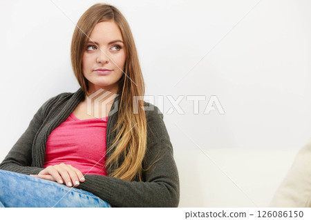 Disbelieving beautiful woman in red 126086150