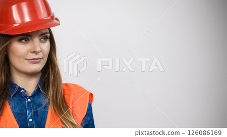 Woman engineer construction builder in helmet. Woman engineer construction builder in helmet. 126086169