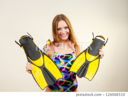 Woman with flippers and snorkeling mask having fun Woman with flippers and snorkeling mask having fun 126086510