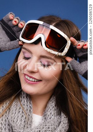 skier girl wearing warm clothes ski googles portrait. skier girl wearing warm clothes ski googles portrait. 126086529
