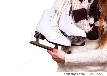woman holding ice skates 126086530