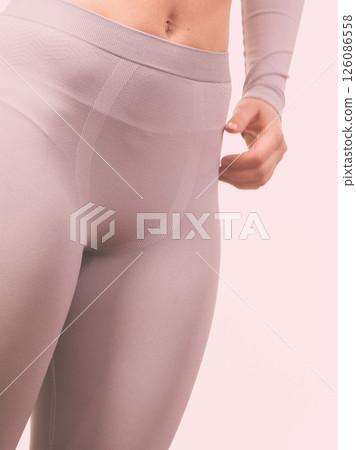 Sport fit woman in thermal clothes. Sport fit woman in thermal clothes. 126086558