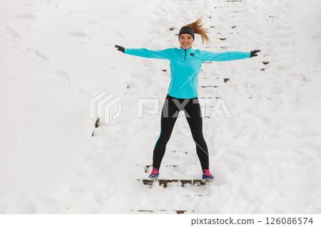 Girl enjoying winter time. Girl enjoying winter time. 126086574